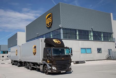 A truck parked in front of a building.