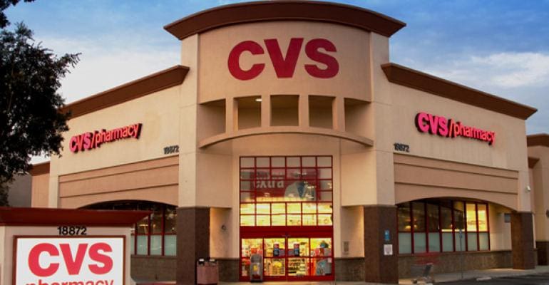 A cvs store front with the company logo on it.