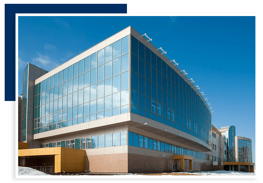 A large building with many windows and glass.